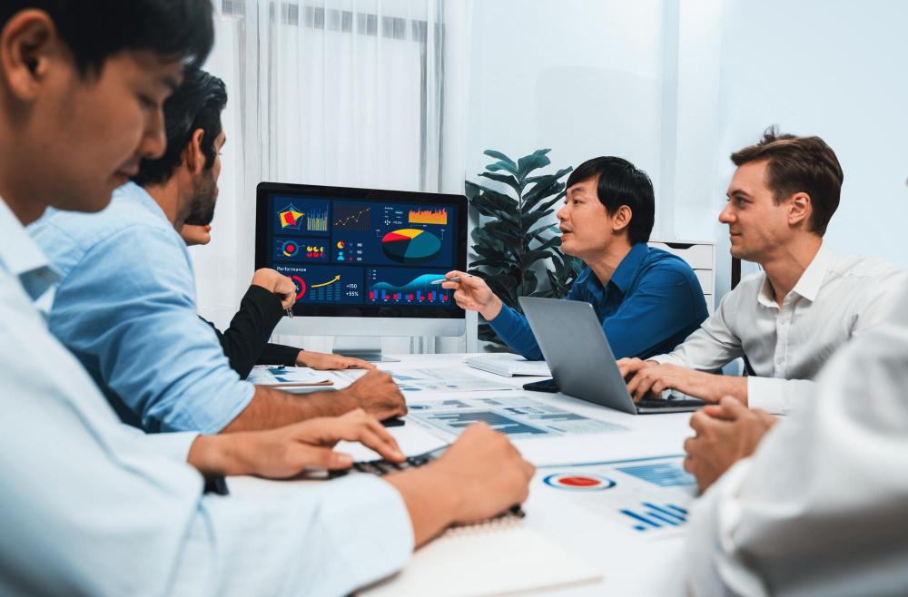 Business intelligence team analyzing data in meeting room