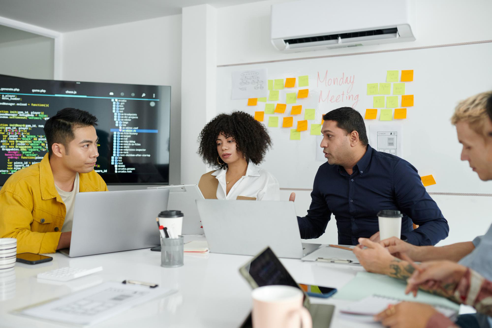 Team of developers brainstorming and optimizing code